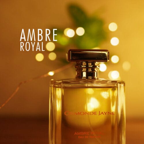 A 50ml bottle of Ormonde Jayne Ambre Royal Eau de Parfum with an elegant, glass bottle featuring gold accents, placed on a brown table.