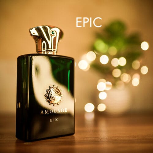 A 100ml bottle of Amouage Epic Man Eau de Parfum with green glass and a gold cap on a brown table.