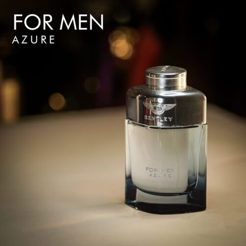 A 100ml bottle of Bentley For Men Azure Eau de Toilette, featuring a semi blue liquid in a transparent glass bottle with a silver-colored metal cap, set on a white table.
