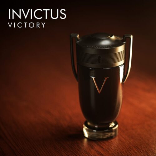 a 100ml bottle of Paco Rabanne Invictus Victory Eau de Parfum with a sleek trophy-inspired design, black and gold accents, and a black cap on a brown table.