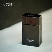 A dark tinted bottle of Tom Ford Noir Eau De Parfum with white font labels.