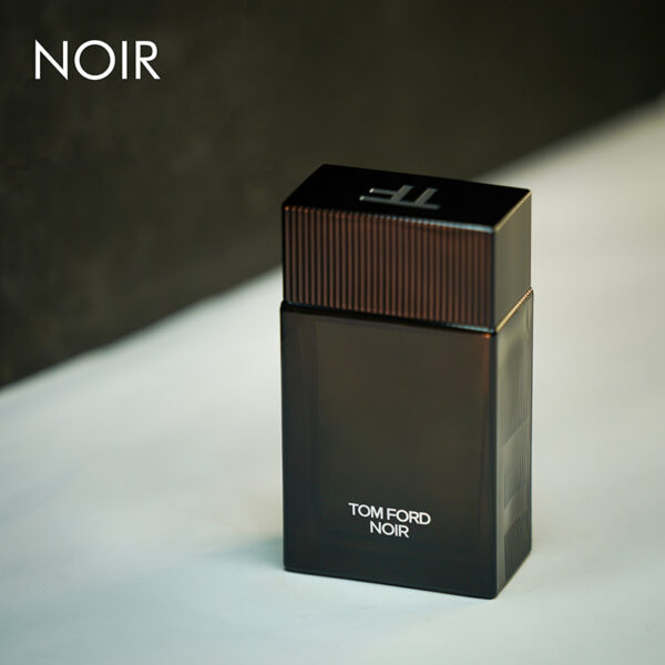 A dark tinted bottle of Tom Ford Noir Eau De Parfum with white font labels.