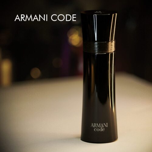 a 125ml bottle of Armani Code Eau de Toilette with a sleek cylindrical dark blue glass design and a black cap on a white table.