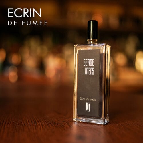 a 100ml bottle of Serge Lutens Ecrin de Fumée Eau de Parfum with a minimalist rectangular glass design and black cap on a brown table