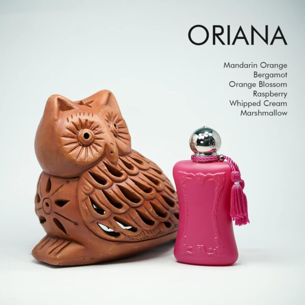 a 75ml bottle of Parfums de Marly Oriana Eau de Parfum with a pink and gold glass design and gold cap on a white table