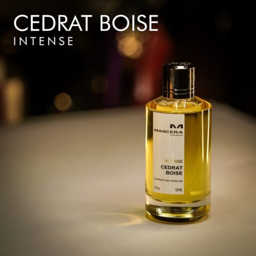 a 120ml bottle of Mancera Cedrat Boise Intense Extrait de Parfum with a gold glass design and black cap on a white table