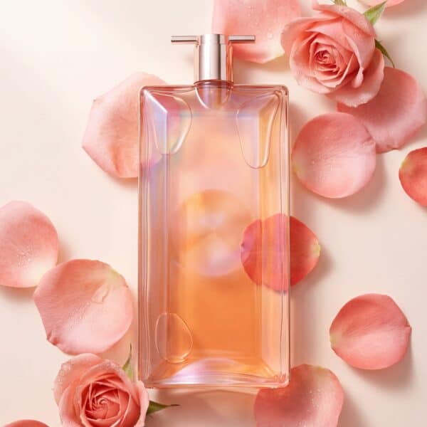 Elegant pink perfume bottle with rose petals for floral fragrance, romantic gift idea, and natural aroma.