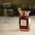 a 100ml bottle of Tom Ford Lost Cherry Eau de Parfum with a deep red glass design and gold label on a white table