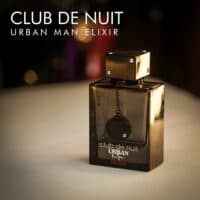 a 105ml bottle of Armaf Club de Nuit Urban Elixir Eau de Parfum with a black matte glass design and studded cap on a white table