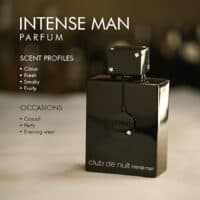 A 100ml bottle of Armaf Club de Nuit Intense Man Parfum with a black cap and clear liquid with a white label on white table.