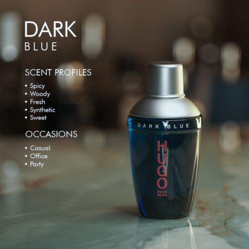 A 100ml bottle of Hugo Boss Hugo Dark Blue Eau de Toilette with dark blue liquid and silver cap on a marble table.