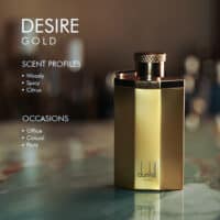 A 100ml bottle of Dunhill Desire Gold Eau de Toilette with golden design and a gold cap on a marble table.