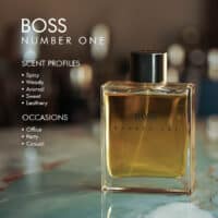 A 100ml bottle of Hugo Boss Boss Number One Eau de Toilette with a golden liquid and black cap on a marble table.