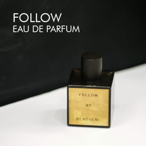 A 100ml bottle of Kerosene Follow Eau de Parfum with a black and gold design on a white table