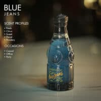 A 100ml bottle of Versace Blue Jeans Eau de Toilette with a blue design and a black cap on a white table