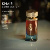 A 100ml bottle of Paris Corner Khair Confection Eau de Parfum with a red and gold design on a marble table