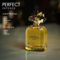 A 100ml bottle of Marc Jacobs Perfect Intense Eau de Parfum with a gold and clear design on a marble table