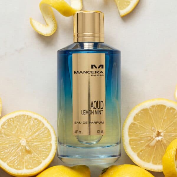 Singles (17) Juicy lemon and mint perfume bottle surrounded by fresh lemon slices and zest.