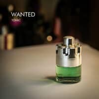 A 100ml bottle of Azzaro Wanted Tonic Eau de Toilette with a silver and green design on a white table
