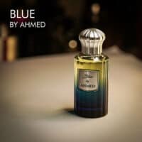 A 100ml bottle of Ahmad AL Maghribi Blue by Ahmed Eau de Parfum with a blue and yellow design on a white table