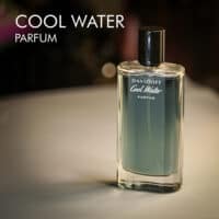 A 100ml bottle of Davidoff Cool Water Parfum with a blue design and a black cap on a white table