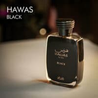 A 100ml bottle of Rasasi Hawas Black Eau de Parfum with a black design on a white table