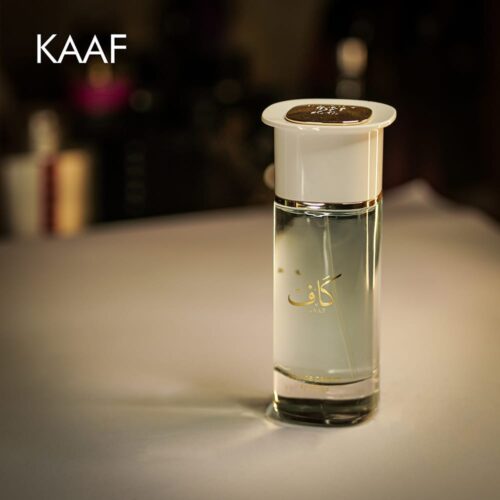 A 100ml bottle of Ahmad AL Maghribi Kaaf Eau de Parfum with a clear design and white cap on a white table