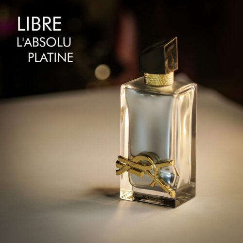 A 100ml bottle of Yves Saint Laurent Libre L’Absolu Platine Eau de Parfum with a silver design and black cap on a white table