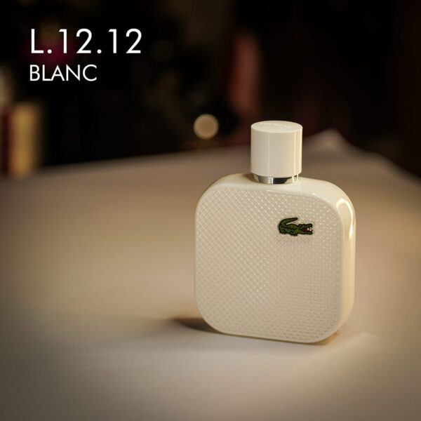 A 100ml bottle of Lacoste L.12.12 Blanc Eau de Parfum with a white design and a green logo on a white table