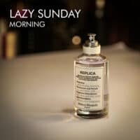 A 100ml bottle of Maison Margiela Lazy Sunday Morning Eau de Toilette with a clear design and a white label on a white table