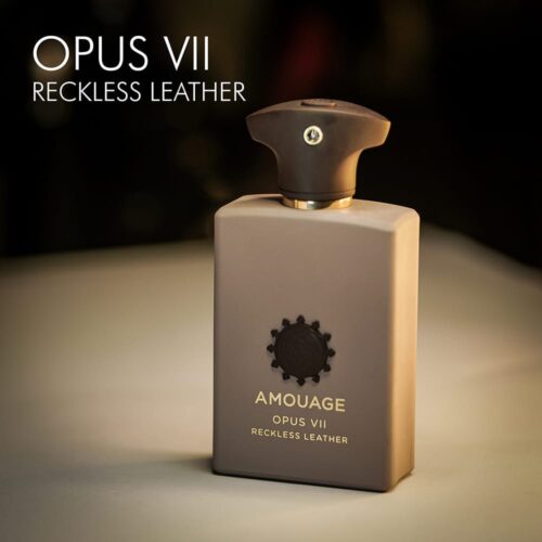 A 100ml bottle of Amouage Opus VII Reckless Leather Eau de Parfum with a pink dark design and a coffee cap on a white table