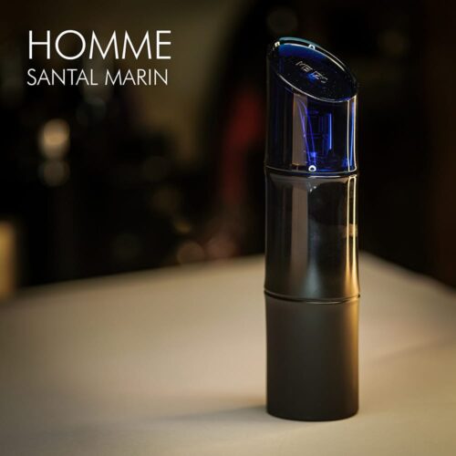 A 100ml bottle of Kenzo Homme Santal Marin Eau de Toilette with a deep blue design on a white table