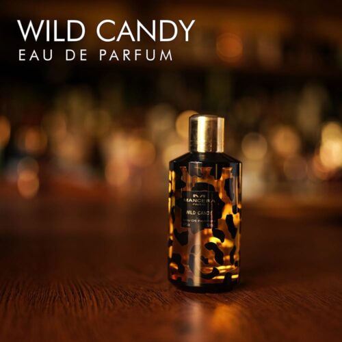 A 100ml bottle of Mancera Wild Candy Eau de Parfum with a black and gold design on a white table