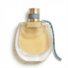 Luxurious perfume bottle with gold accents and blue ribbon, elegant and stylish design.