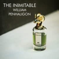 A clear bottle with a gold ram-head cap of Penhaligon's The Inimitable William Penhaligon Eau de Parfum with black font labels.