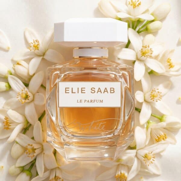Elegant Elie Saab Le Parfum White perfume surrounded by jasmine flowers for feminine fragrance and luxury scent.