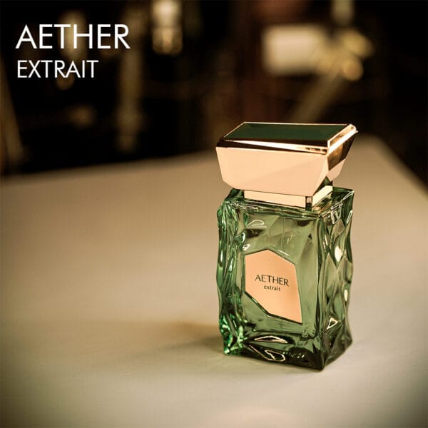 A 100ml bottle of French Avenue Aether Eau de Parfum with an elegant green bottle with gold label on a white table