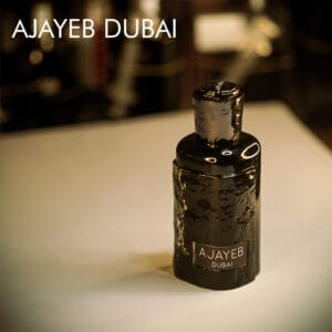 A 100ml bottle of Lattafa Ajayeb Dubai Eau de Parfum in a jagged glass bottle with white label