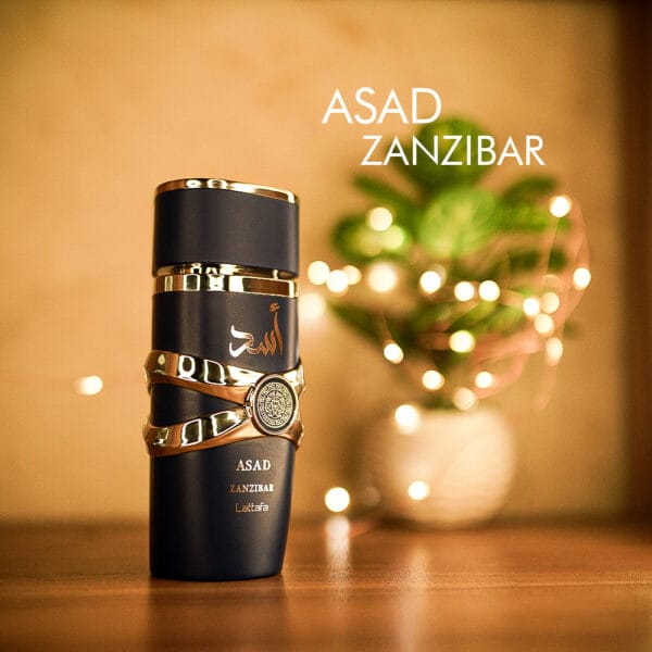 A 100ml bottle of Lattafa Asad Zanzibar Eau de Parfum with a black bottle with gold design on a brown table