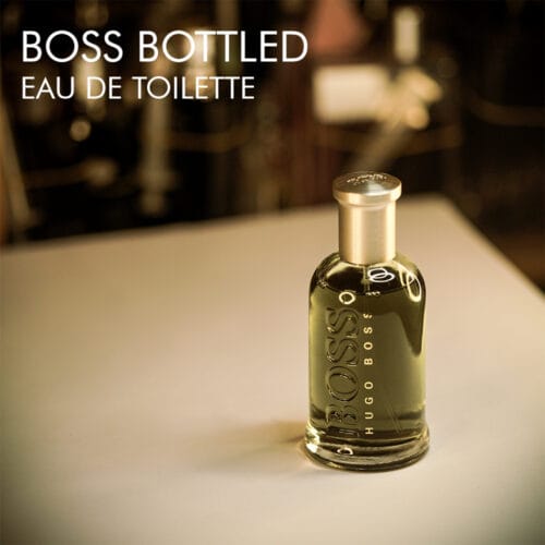 A 100ml bottle of Hugo Boss Bottled Eau de Toilette with engraved logo on a white table