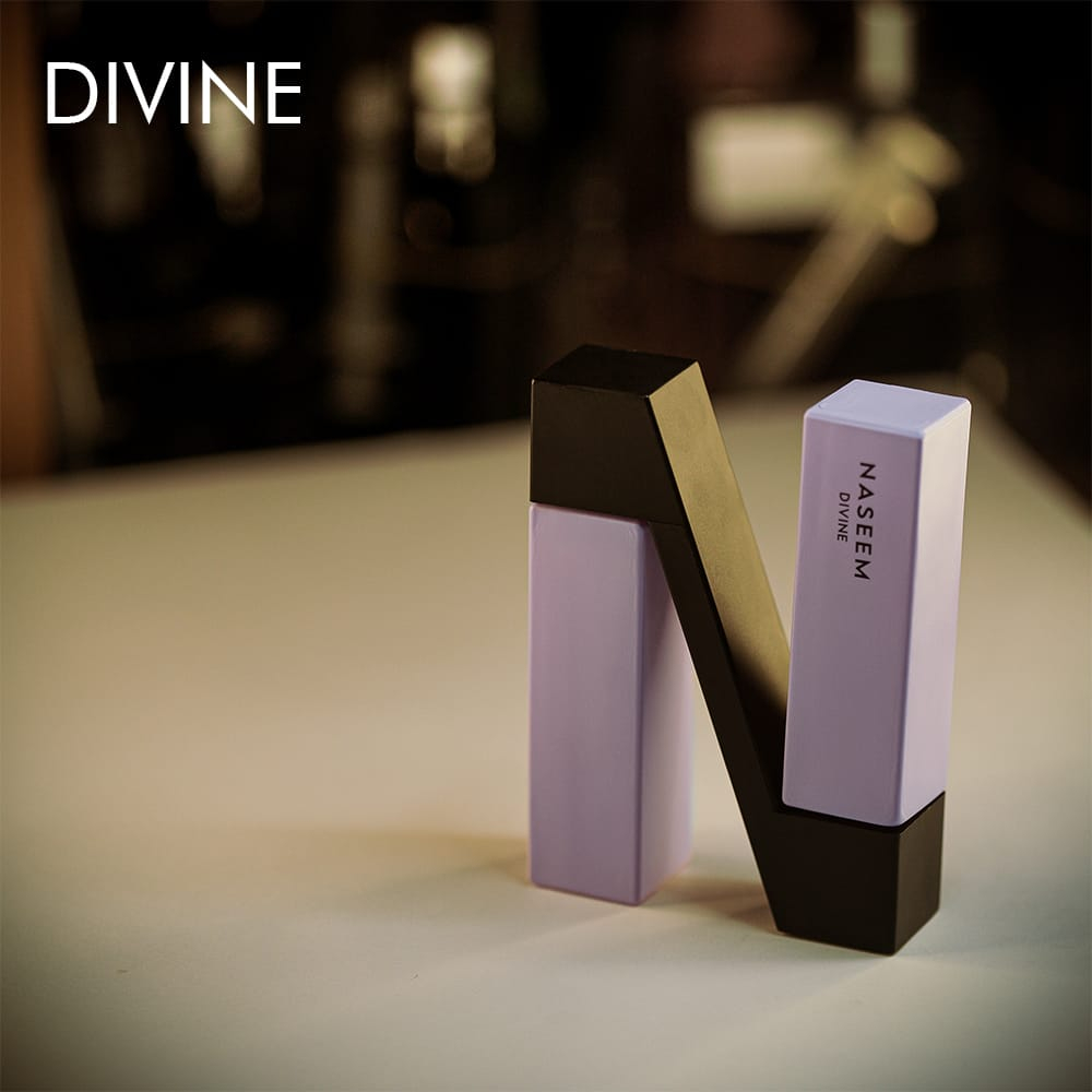 Two 30ml bottle of Naseem Divine Aqua Eau de Parfum with a purple and black design on a white table