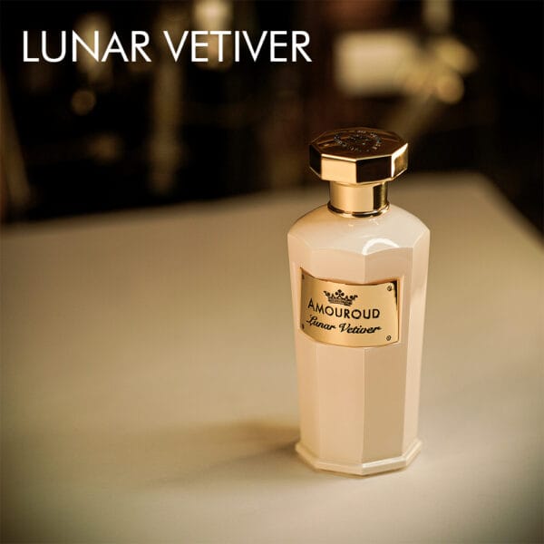 A 100ml bottle of Amouroud Lunar Vetiver Eau de Parfum with an elegant white and gold design on a white table