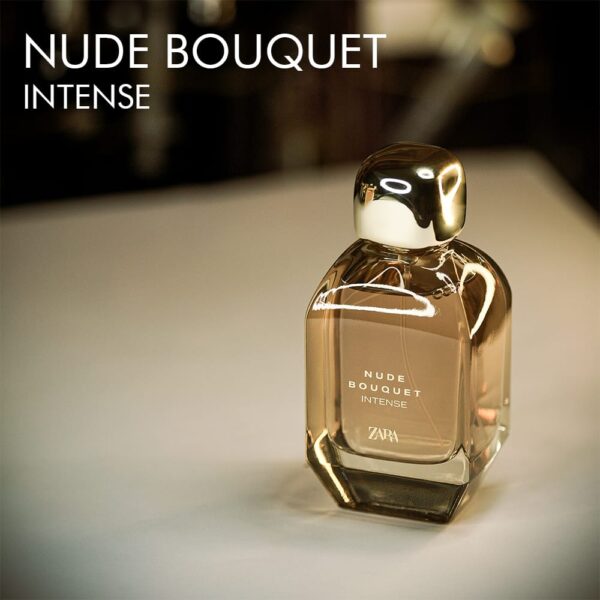 A 100ml bottle of Zara Nude Bouquet Intense transparent golden bottle with white label on a white table