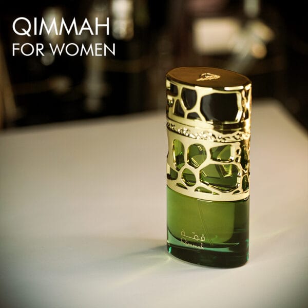 A 100ml bottle of Lattafa Qimmah For Women Eau de Parfum with golden green bottle on a white table