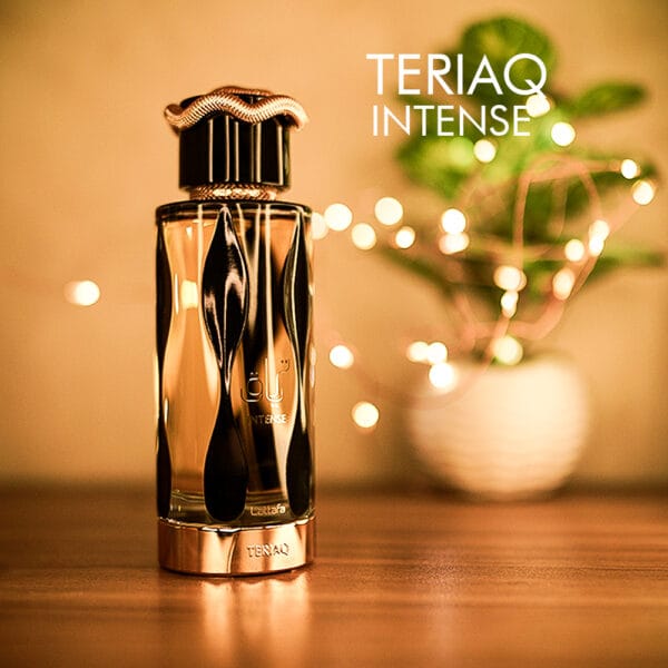 A 100ml bottle of Lattafa Teriaq Intense Eau de Parfum with a black and gold design on a brown table.