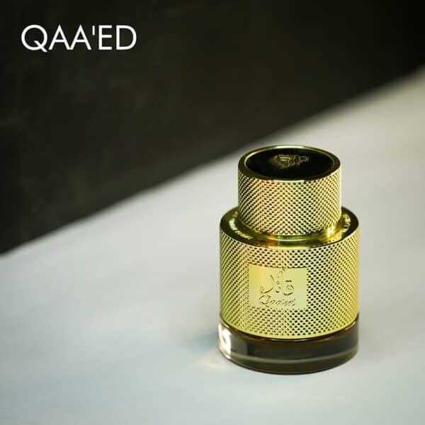 A golden bottle of Lattafa Qaa'ed Eau De Parfum with engraved labels.